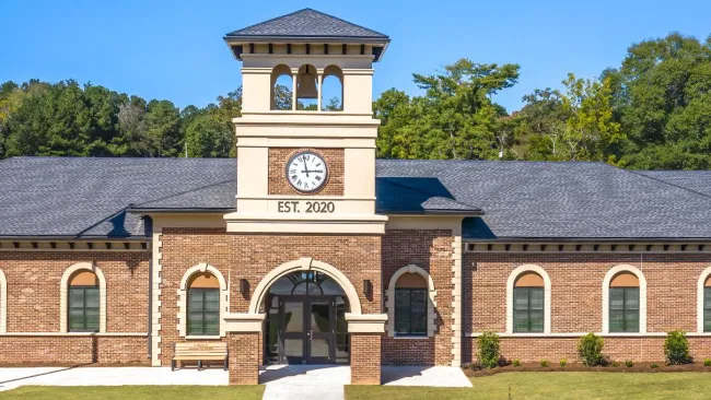 a large brick building with a clock tower