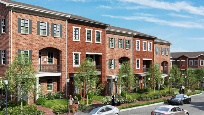 a brick building with cars parked in front of it