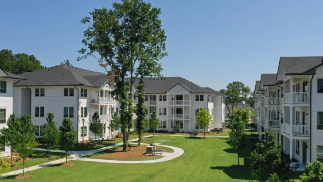 a large building with trees in front of it