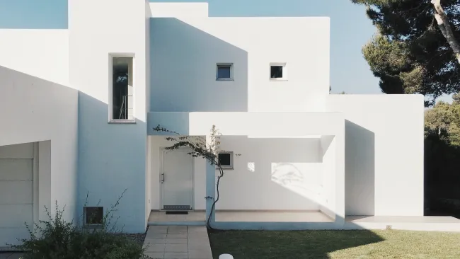 a white house with a driveway in texas