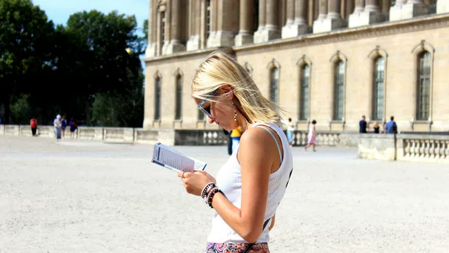 a woman looking at a book