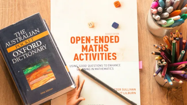 a book and a pen on a table