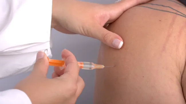 a person receiving an injection