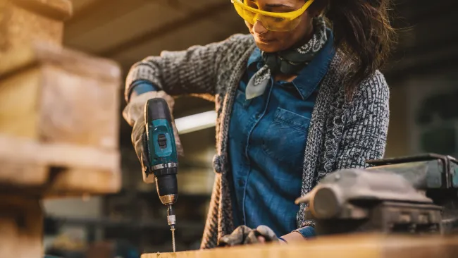 a person wearing a mask and holding a gun