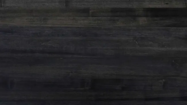 Dark black wooden texture with subtle grain patterns and a matte finish across the surface.