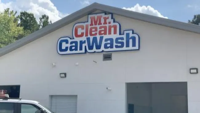 a white building with a blue sign