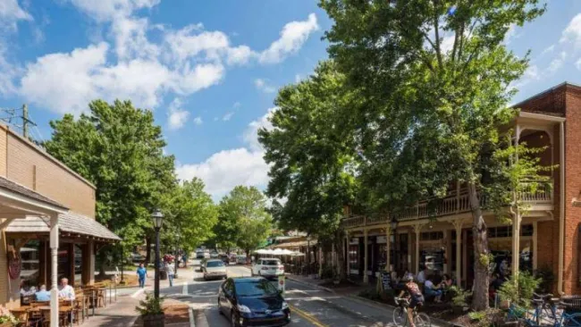 a street with cars and people on it