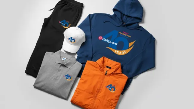 Apparel set featuring a white cap, navy hoodie, gray polo, orange jacket, and black pants with 40 years logo
