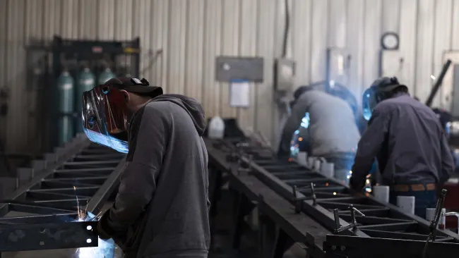 a group of people working in a factory