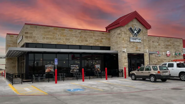 a building with cars parked in front