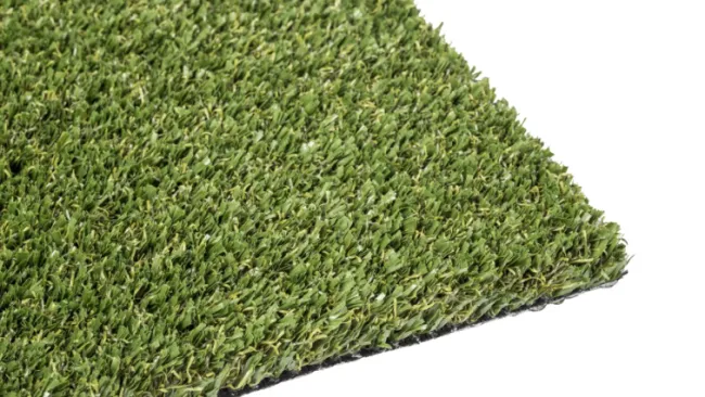 Close-up of a square piece of green artificial turf with a black backing on a white background.
