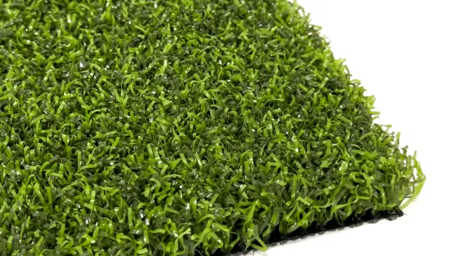 Close-up of vibrant green artificial grass showcasing realistic texture and fibers.