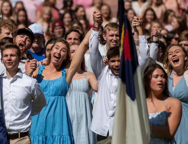 a group of people holding flags