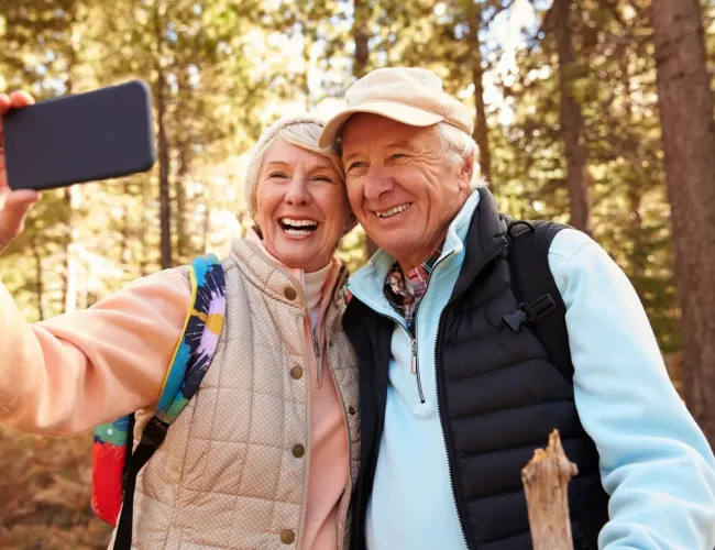 an active adult couple taking a selfie