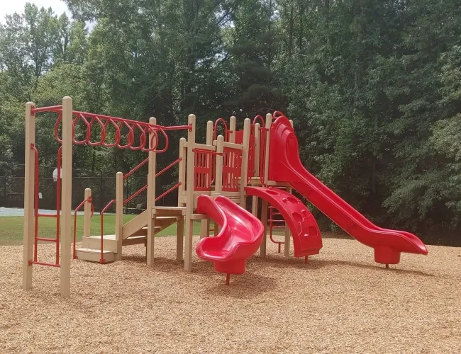 a playground with red slide