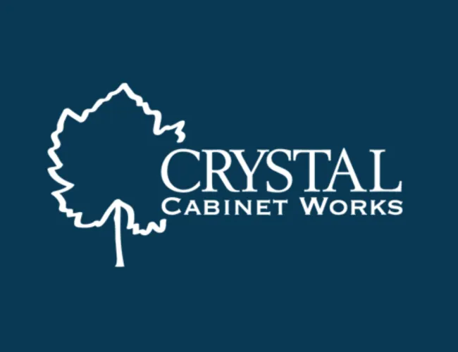 Crystal Cabinet Works logo with white leaf outline and text on dark blue background