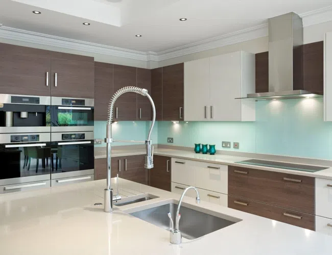 a kitchen with white cabinets