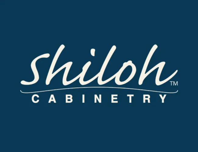 Shiloh Cabinetry logo with white cursive and block text on a dark blue background