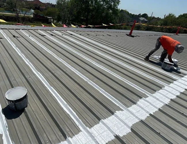 Mattco roofer repairing standing seam metal roof commercial property Texas