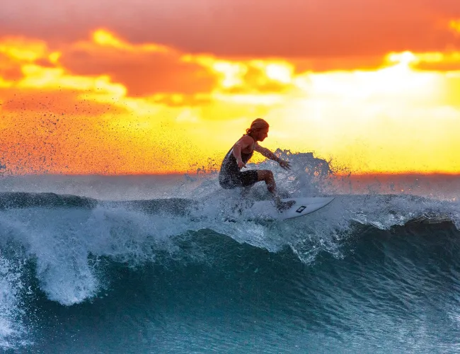 a man surfing on a wave
