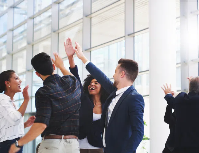 People celebrating successfully using AI in NetSuite
