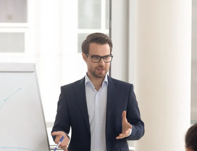 a person standing in front of a group of people