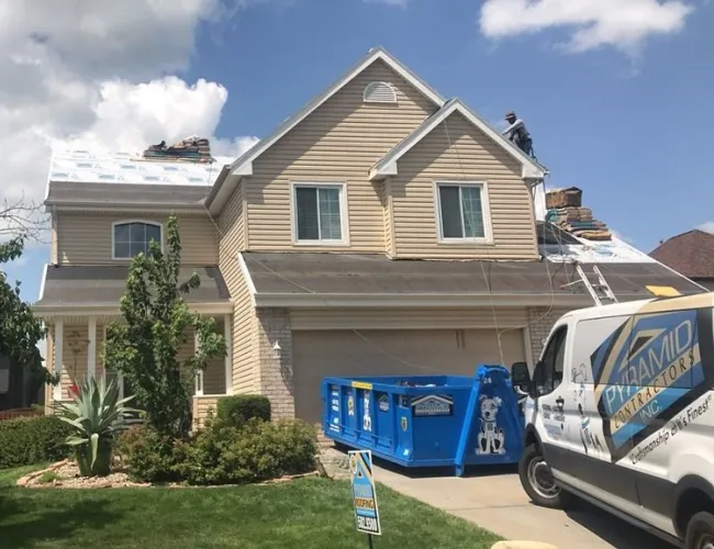 a house with a truck parked in front of it