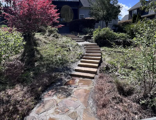 a stone path leading to a house