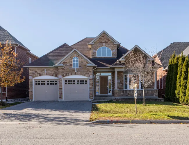 a large brick house with garages
