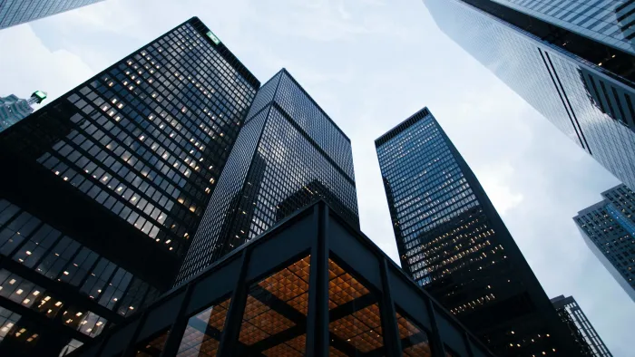 a tall glass tower in a city