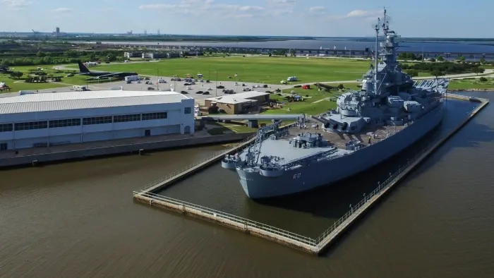 a boat is docked next to a body of water
