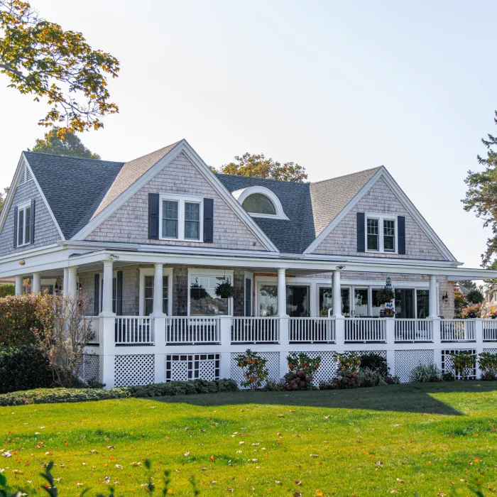 a house with bushes in front of a building