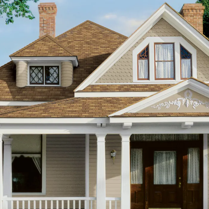 a house with a porch and 3 tab supreme shingles
