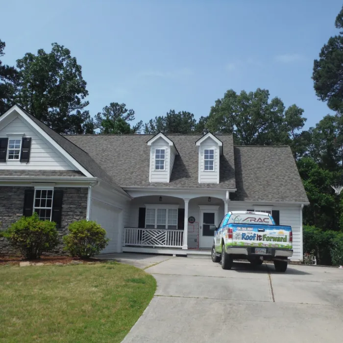 a house with trees in the background