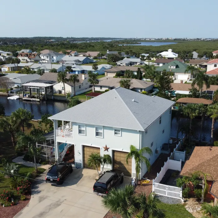 Aerial view of a full roof replacement in Jacksonville, Florida by ARAC Roof It Forward