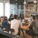 a group of people sitting at tables