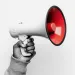 a hand holding a megaphone
