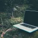 a laptop on the grass