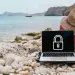 a laptop on a rocky beach