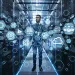 Businessman standing in data center surrounded by digital icons representing technology and cloud computing
