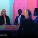 a group of people sitting around a table