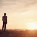 a man standing on a hill