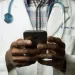 a doctor holding a phone