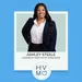 Ashley Steele, Corporate Director of Operations, against a blue background.