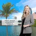 Smiling woman in blazer stands by water with palm tree and Tampa, FL city skyline in background under blue sky