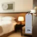 a room with a bed and a lamp