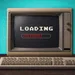 Vintage computer with loading screen showing dollar signs, set against a teal background on a wooden desk.