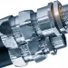Close-up of hydraulic hoses with shiny metal connectors and threaded fittings on white background