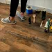 a person standing on a wood floor