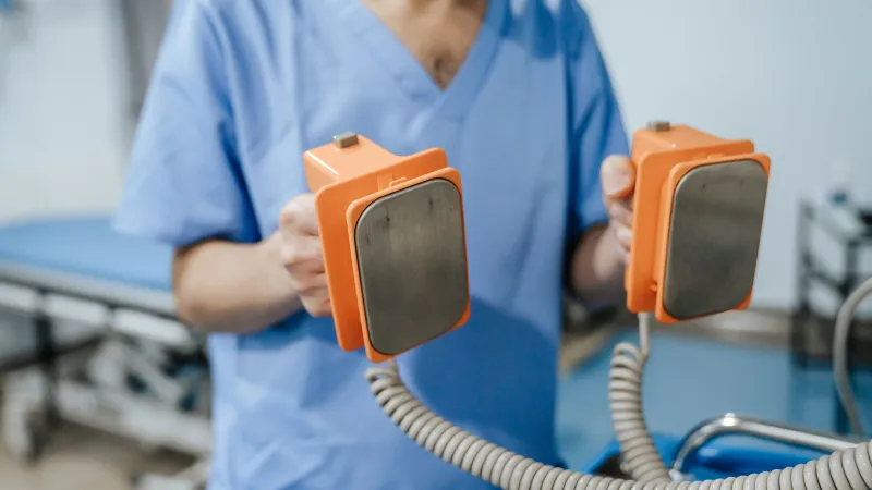 a doctor holding a device